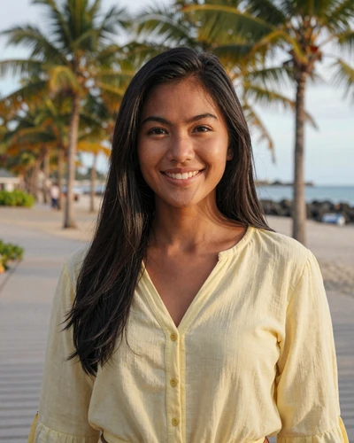 Jasmine, 25, Filipina woman from Cebu in a yellow blouse on a tropical boardwalk