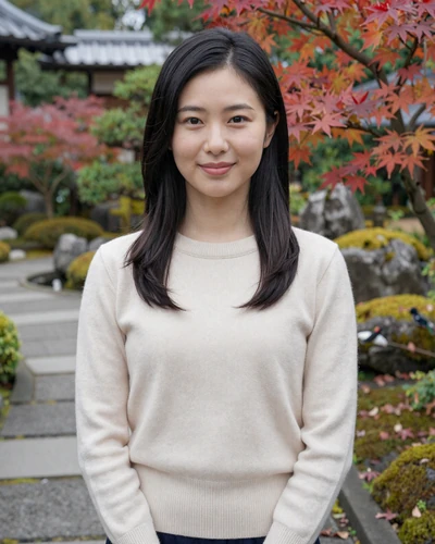 Hana, 29, Japanese woman from Kyoto in a cream sweater in a traditional Japanese garden